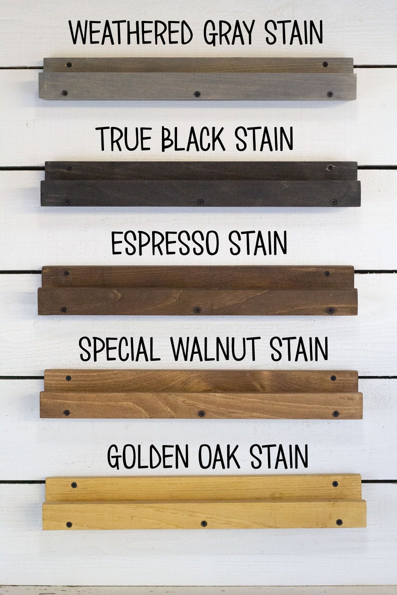 May include: Five wooden shelves stained in different colors, including weathered gray, true black, espresso, special walnut, and golden oak. Each shelf is labeled with the stain color.