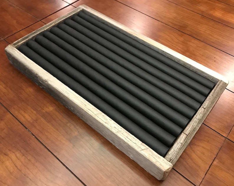 May include: A wooden ring holder with a black felt lining. The holder has 10 slots for rings.