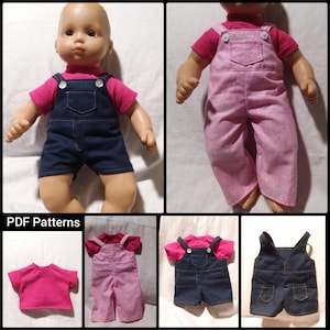 May include: A doll dressed in a pink short-sleeved top and denim dungarees. The dungarees feature white buttons and pockets. The image also shows a pink and denim outfit, and a pink shirt.