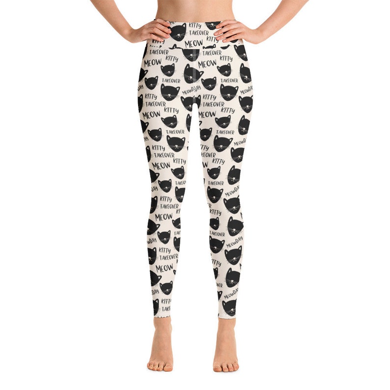 May include: Black and white leggings with a repeating pattern of black cats and the text "Kitty Takeover Meow".