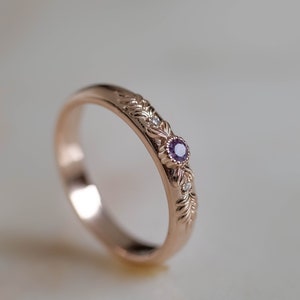 unusual wedding ring nade in rose gold with gold branch and lad alexandrite