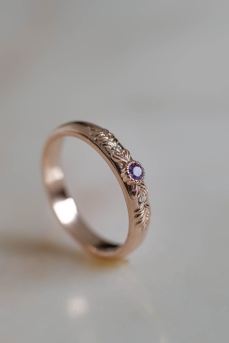 unusual wedding ring nade in rose gold with gold branch and lad alexandrite