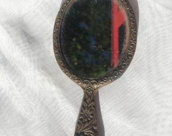 Art Nouveau hand mirror made of bronze with a floral motif on both sides and a picture of Oberammergau on the back
