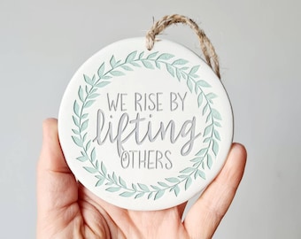We rise by lifting others - inspirational quote - motivational wall decor - positive life quote - hanging clay decoration