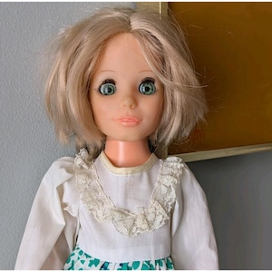 May include: A set of three ceramic mugs with a speckled, matte finish. The mugs are in shades of cream, light grey, and dark grey. Each mug has a simple, minimalist design, ideal for coffee or tea.