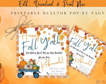 May include: Two printable realtor pop-by tags with a fall theme. The tags feature a white background with a checkered pattern and a wagon filled with pumpkins and gourds. The text on the tags reads "Happy Fall Y'all" and "Just Rolling By To Tell You How Thankful We Are For Your Referrals!" with the realtor's name and contact information below.