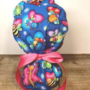 Surgical scrub cap with ponytail, Bright Bugs