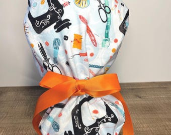 Women’s Ponytail surgical scrub cap with Sewing theme.