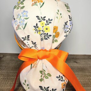 Women’s surgical scrub cap with ponytail.