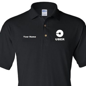May include: Black polo shirt with a white Uber logo and the text "UBER" below it. The shirt also has the text "Your Name" on the left side of the chest.