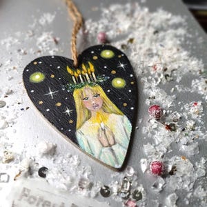 Hand Painted St. Lucia Wooden Ornament: Rustic Winter Decoration