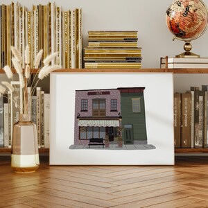 May include: A digital illustration of a two-storey building with a cafe on the ground floor. The building is painted in shades of pink, green, and brown. The cafe has a sign that reads "Bean Runner Cafe".
