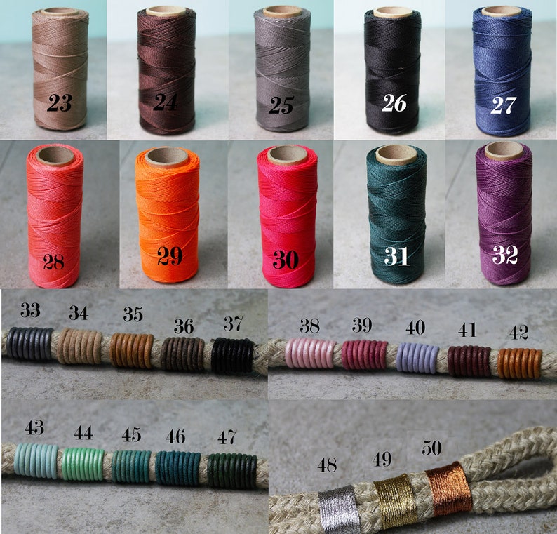 May include: A collection of spools of thread and cord segments labeled with numbers 23 through 50. The spools display various solid colors including brown, gray, black, blue, orange, red, green, and purple. The cord segments feature wrapped thread accents.