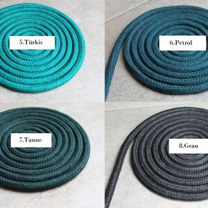 May include: Four coils of braided rope arranged in a grid. Each coil is a different colour: turquoise labelled 5.T&uuml;rkis, petrol blue labelled 6.Petrol, dark pine green labelled 7.Tanne, and dark grey labelled 8.Grau. The rope has a textured surface.