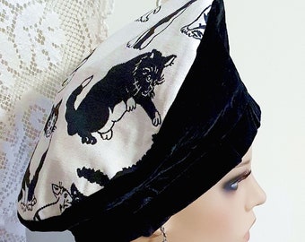 Extravagant black velvet hat with cute tapestry cat fabric in an elegant black and white pattern