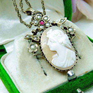 Magical Art Nouveau cameo necklace, silver with a shell gem surrounded by flower tendrils with oriental pearls and a ruby