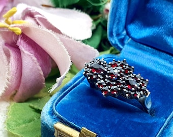 Unusual silver vintage garnet ring with florally arranged Bohemian rose cut garnet stones