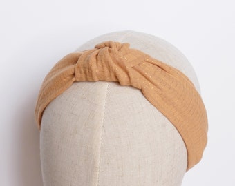 Caramel cotton gauze bow headband with golden lines.