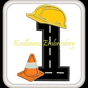 May include: A black number one with a yellow construction hat on top and a white and orange traffic cone to the left. The number one is a road with white lines. The text "Koolbeanz Embroidery" is below the number.