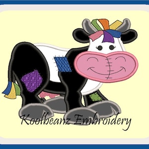 May include: A black and white patchwork cow with a pink nose and a colorful bow on its head. The cow is standing on a yellow background with the text "Koolbeanz Embroidery" below it.