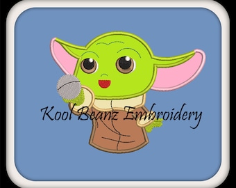 Baby alien with ball. This is a digital applique, machine embroidery file. It has some fill stitches in it, In sizes 4x4 5x7 6x10.