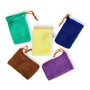 May include: Five colorful soap saver bags in green, yellow, blue, brown, and purple. Each bag is made of a mesh material and has a drawstring closure with orange and yellow cord. A small tag is attached to the yellow bag.