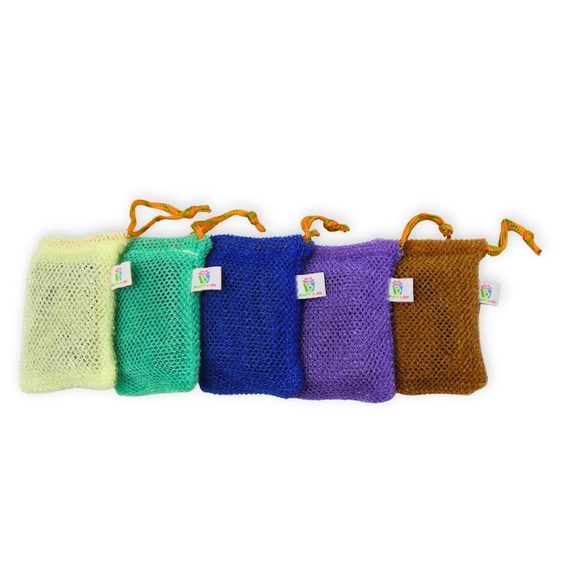 May include: Five colorful mesh soap bags in yellow, green, blue, purple, and brown. Each bag has a matching drawstring and a small white tag. The bags are designed to hold soap and create a rich lather.