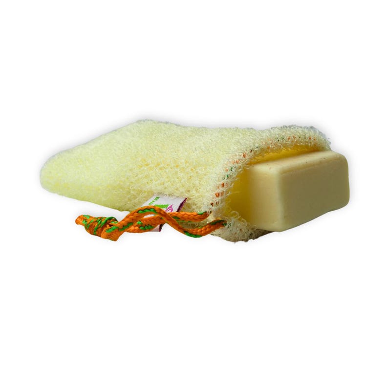 May include: A light yellow loofah soap holder with a bar of soap inside. The holder is made of a mesh material and has an orange and green drawstring. The soap is a light yellow color.
