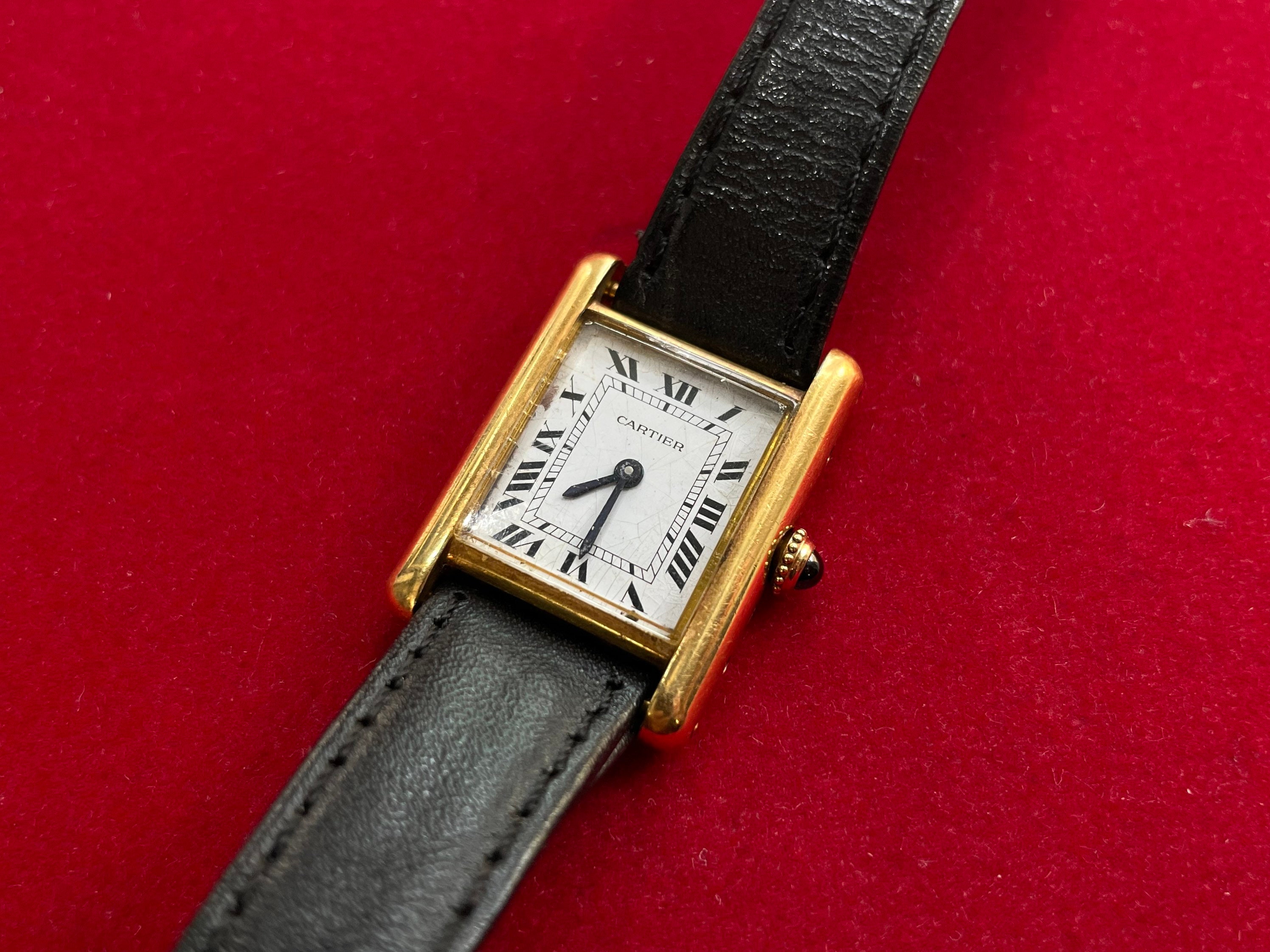 LOT:43  CARTIER - a yellow metal Tank Louis wrist watch, 20x20mm.