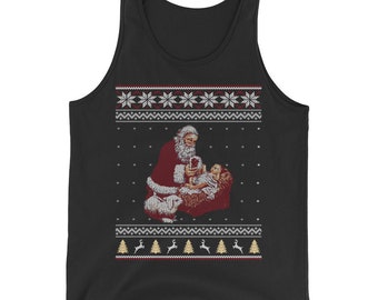 May include: Black tank top with a Christmas-themed design featuring Santa Claus holding a baby Jesus. The design includes a red and white snowflake pattern, a green Christmas tree, and a reindeer.