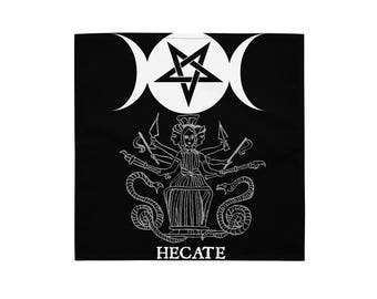 May include: Black square textile with a white illustration of a pentagram, crescent moons, and a multi-faced figure with snakes. The word "HECATE" is printed in white at the bottom of the design.