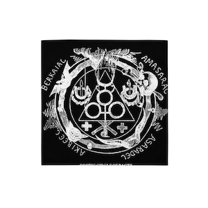 May include: Black square textile with a white occult symbol design. The design includes a central triangle with circles, crosses, and text around the perimeter. The text reads "BERKAIAL", "AMASARAC", "ASARADEL", and "AKIBECC".