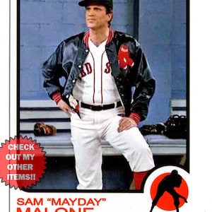 May include: A baseball card featuring a player in a black leather jacket and white baseball uniform with a red 'B' on the hat. The player is standing in a dugout with a baseball bat and glove in the background. The card has the text 'SAM "MAYDAY" MALONE BOSTON RED SOX PITCHER'.