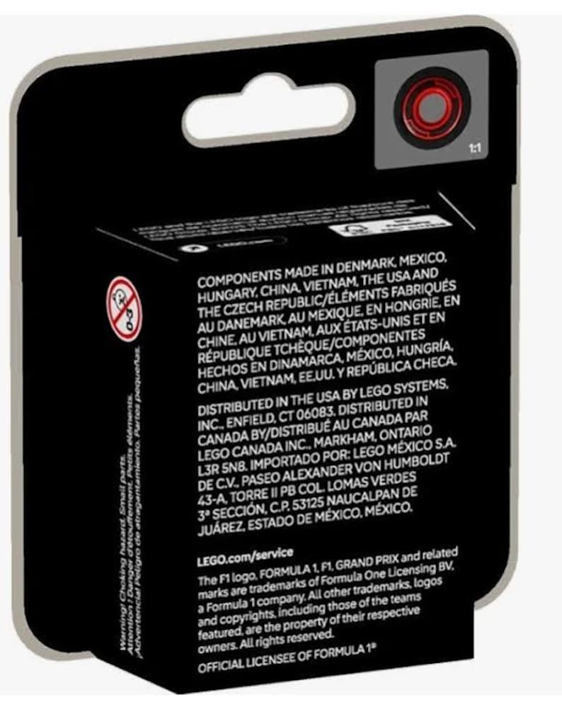 May include: A black LEGO box with a red and white Formula 1 logo. The box has text that reads "Components made in Denmark, Mexico, Hungary, China, Vietnam, the USA and the Czech Republic." The box also has text that reads "LEGO.com/service" and "Official License of Formula 1".