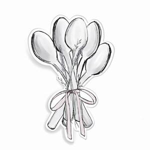 May include: A bouquet of wooden spoons tied together with a pink ribbon and decorated with sprigs of lavender.