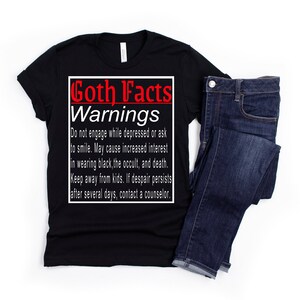 May include: Black t-shirt with white text that reads "Goth Facts Warnings" and includes a list of warnings about goth culture. The text is in a box with a black outline.