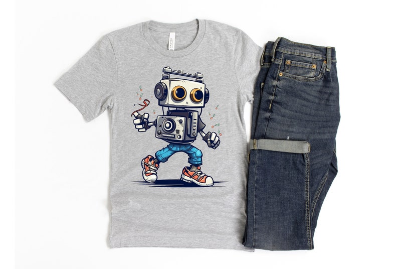 Może przedstawiać: Szary T-shirt z kresk&oacute;wkowym robotem w niebieskich dżinsach i pomarańczowych butach. Robot trzyma czerwoną wstążkę i ma retro styl.