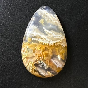 Graveyard Pointe plume agate Cabochon, white n orange plume in clear agate