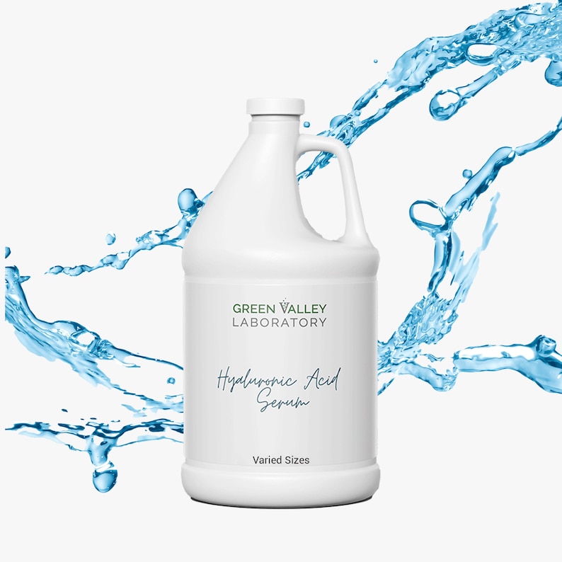 May include: A white plastic bottle with a green label that says "Green Valley Laboratory" and "Hyaluronic Acid Serum". The bottle is surrounded by blue water splashes. The label also says "Varied Sizes".