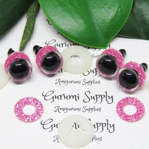 10mm Clear Round Plastic Safety Eyes with a Pink Glitter Non-Woven Slip Iris and Washers: 2 Pairs - Dolls / Amigurumi / Animal / Crochet