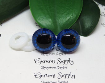 May include: Two blue safety eyes with black pupils, used for amigurumi or other crafts. The eyes are 12mm in diameter.