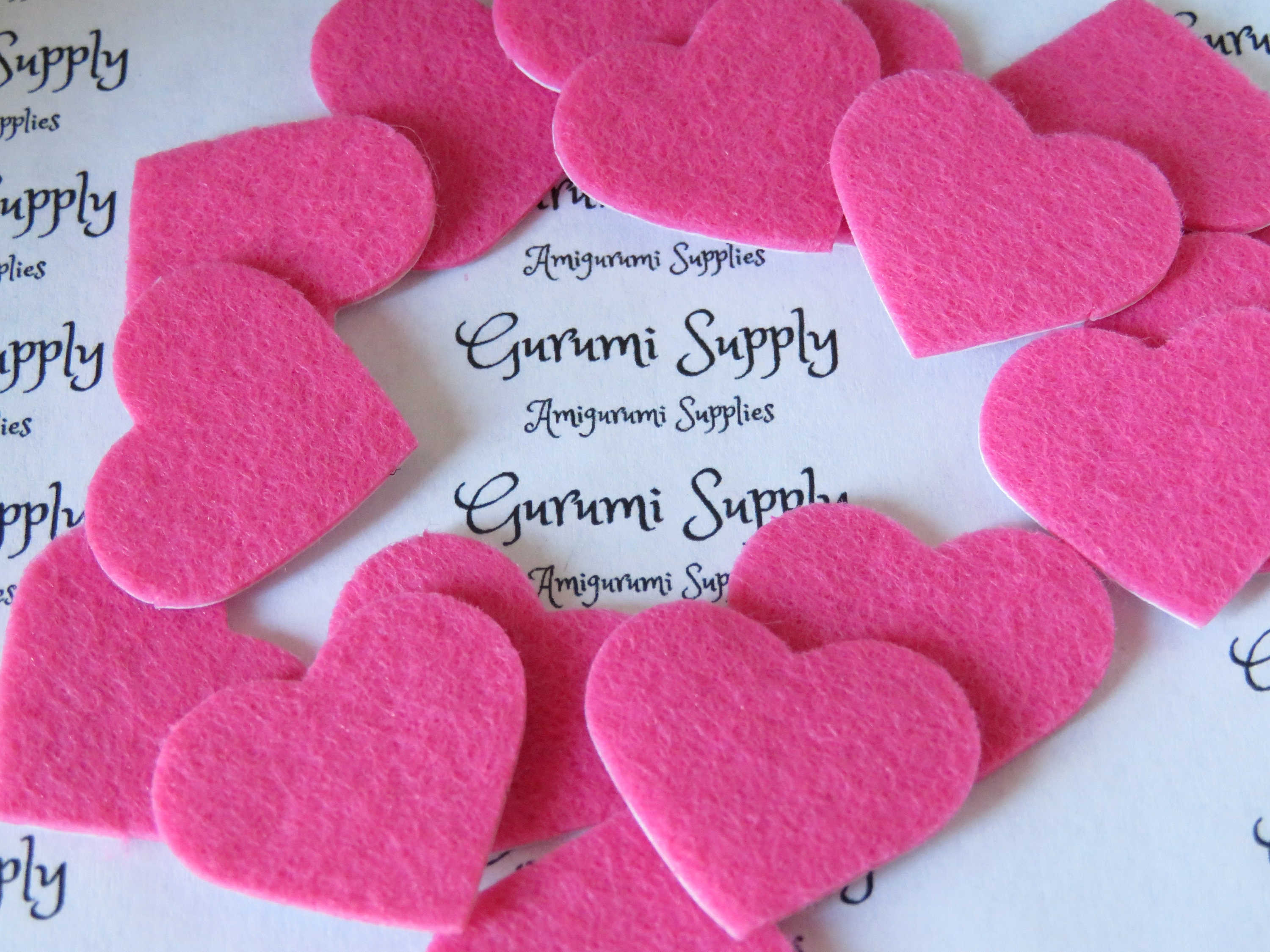 1 inch pink heart shape felt cut outs with a sticker backing 1 color