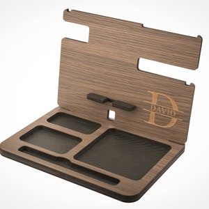May include: A wooden valet tray with a personalized monogram and the name "DAVID" engraved on the side. The tray has multiple compartments for organizing items like watches, keys, and jewelry.
