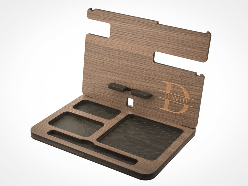 May include: A wooden valet tray with a personalized monogram and the name "DAVID" engraved on the side. The tray has multiple compartments for organizing items like watches, keys, and jewelry.