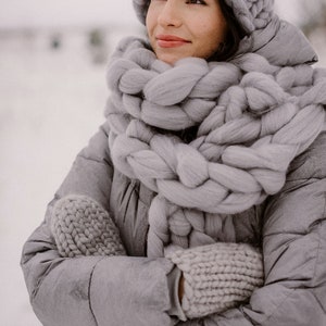 lady wearing set of chunky scarf hat and mittens in gray
