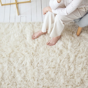 off white area rug is fluffy and soft