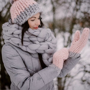 Lady in winter with chunky knit hat gloves and scarf