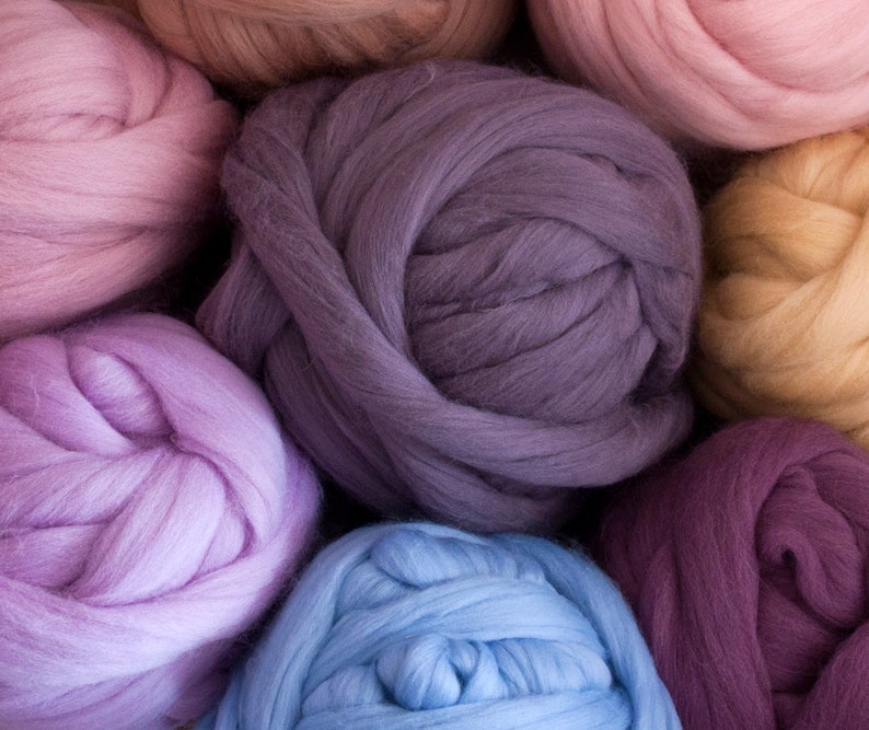 Large balls of chunky merino wool yarn in various colours