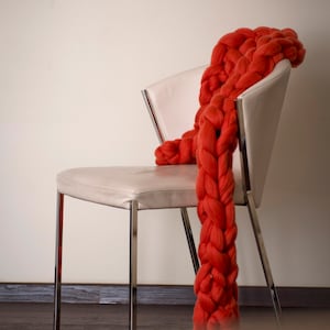 Red merino wool chunky scarf on the chair