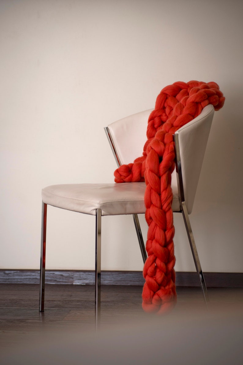 Red merino wool chunky scarf on the chair